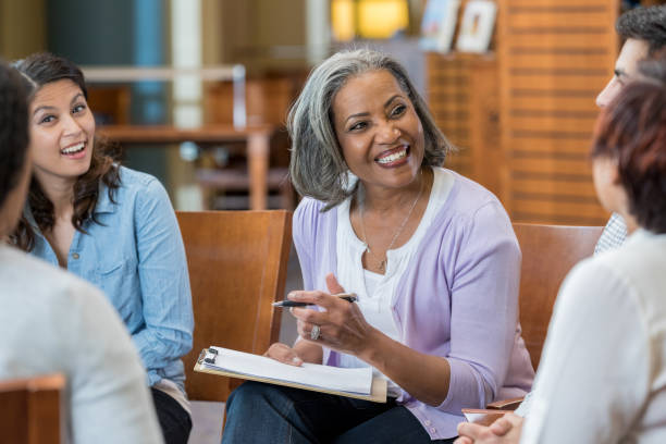 istock African American therapist discusses something with support group 973984432