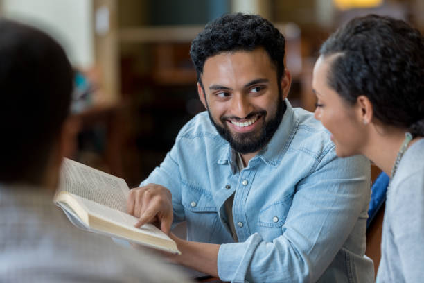istock Man discusses something during book club meeting 973984686