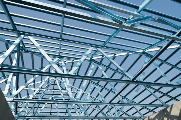 istock Structure of steel roof frame for building construction. 973985196