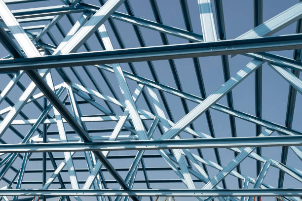 istock Structure of steel roof frame for building construction. 973985228