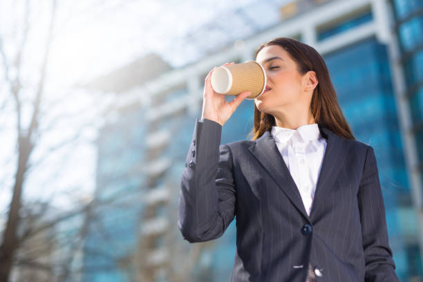 istock A beautiful young businesswoman drinking coffee 974003894
