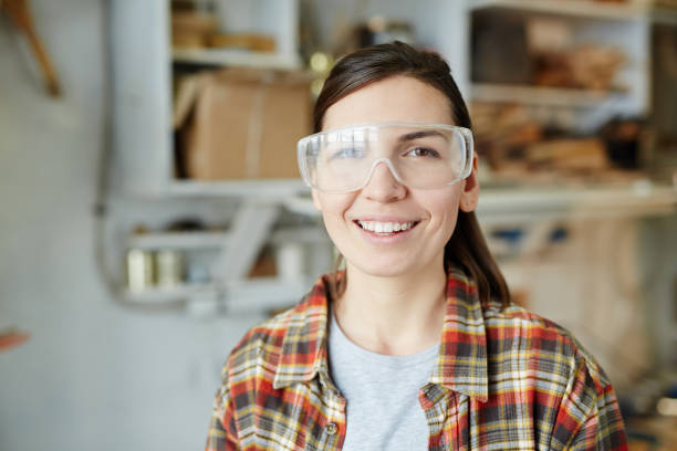 istock Woman in safety goggles looking at camera 974016016