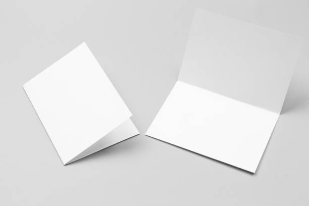 istock Blank portrait mock-up paper. brochure magazine isolated on gray, changeable background / white paper isolated on gray 974016870