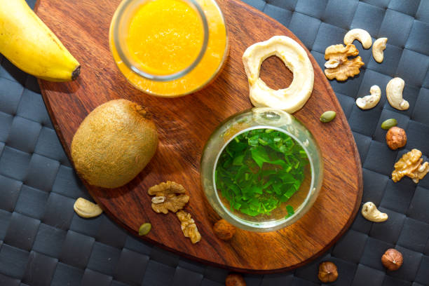 istock Healthy Snack Eating and Drinking Concept with Green Tea 974018058
