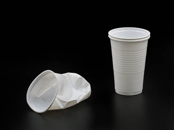 istock Crushed and new plastic cups isolated on black background 974031492