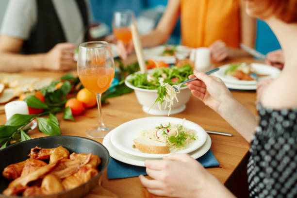 istock Friends eating together at home 974059128
