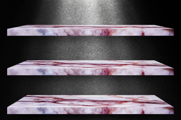 Three empty top of granite marble table on black wall with spotlight backdrop / For product display
