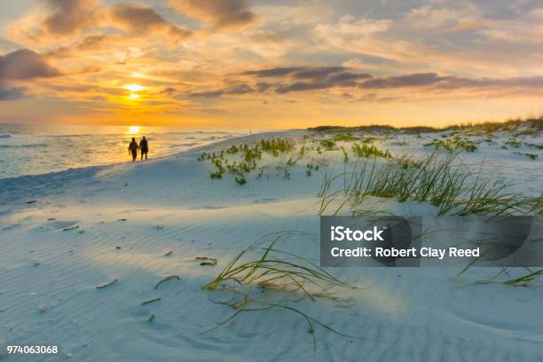Couple Walks On Beach At Sunset Stock Photo - Download Image Now - Beach, Florida - US State, Walking