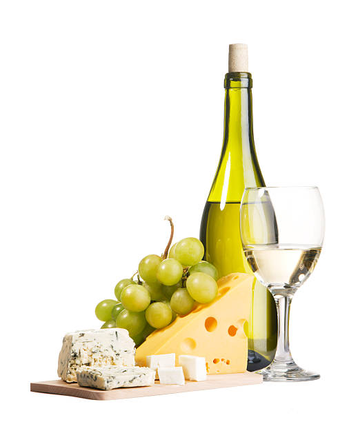 A platter of cheese and grapes with wine