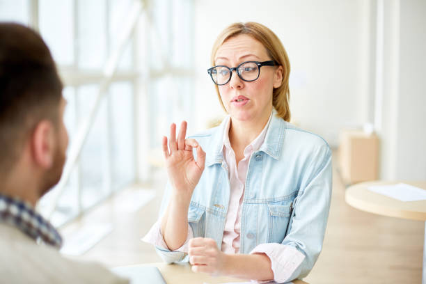 istock Woman having meeting with coworker 974123038