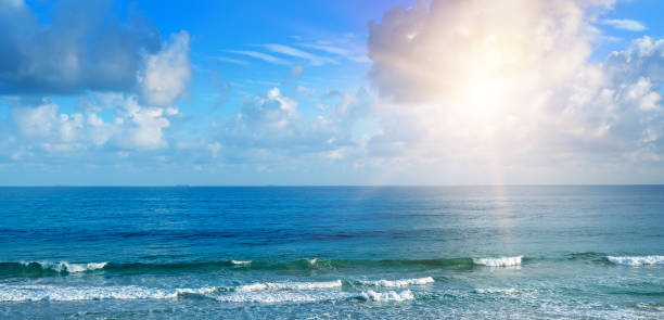 istock Beautiful seascape and sun on blue sky background. 974137752