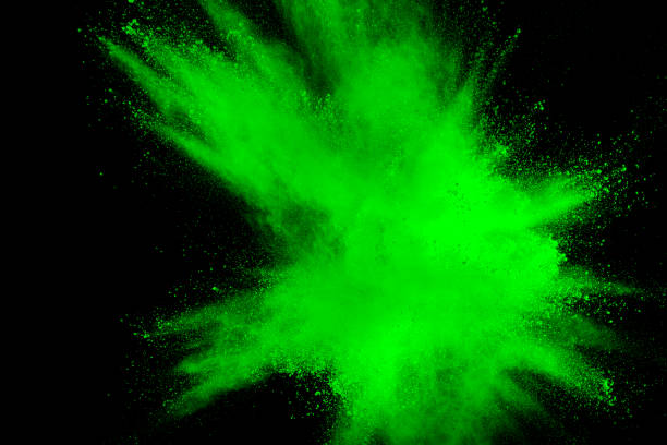 istock abstract green dust explosion on  black background.abstract green powder splattered on black background.Freeze motion of green powder exploding. 974137902