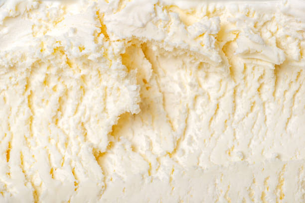 istock texture of white ice cream like background, close up 974138182