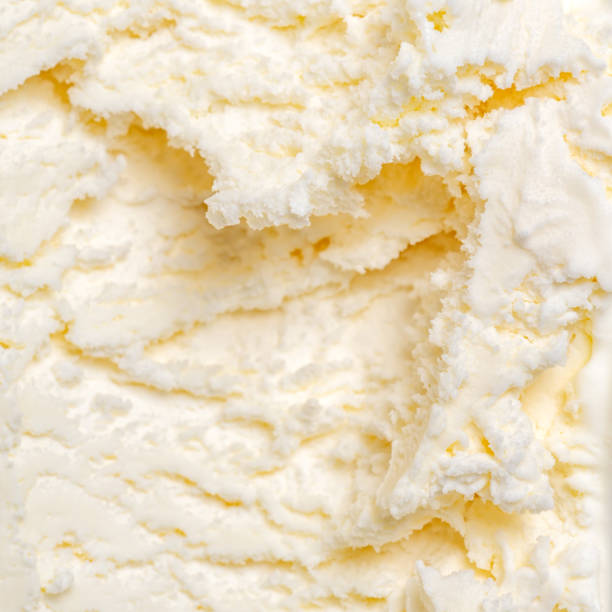 istock texture of white ice cream like background, close up 974138198