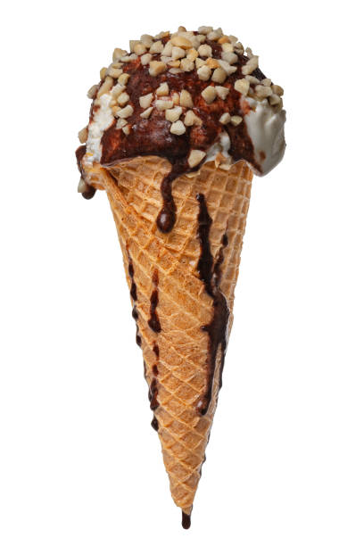 istock wafer cone with melting white ice cream covered chocolate glaze and grated nuts isolated on white background, close up 974138262