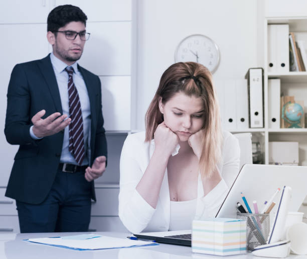 istock Upset woman with disgruntled boss 974148408