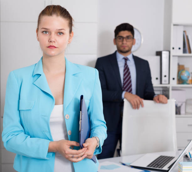 istock Businesswoman standing in office 974148462