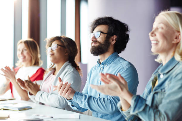 istock Excited people applauding speaker at business forum 974153112