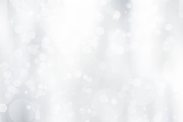 istock white blurred backdrop of nature, circle white wallpaper, gray bokeh background 974153162