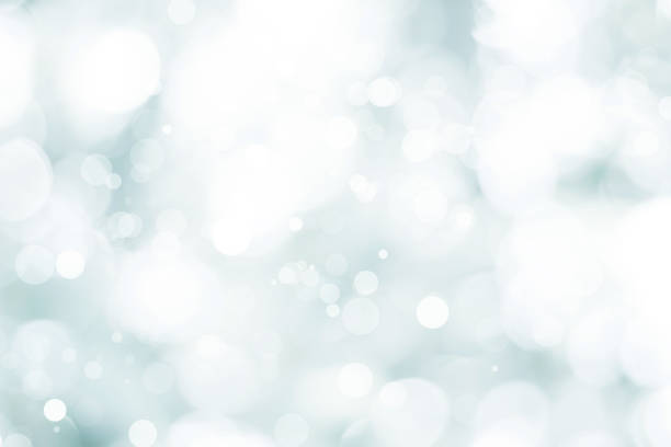 istock white blurred backdrop of nature, circle white wallpaper, gray bokeh background 974154574