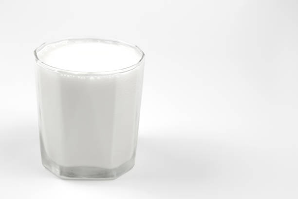 istock glass milk on white background with copy space 974158336