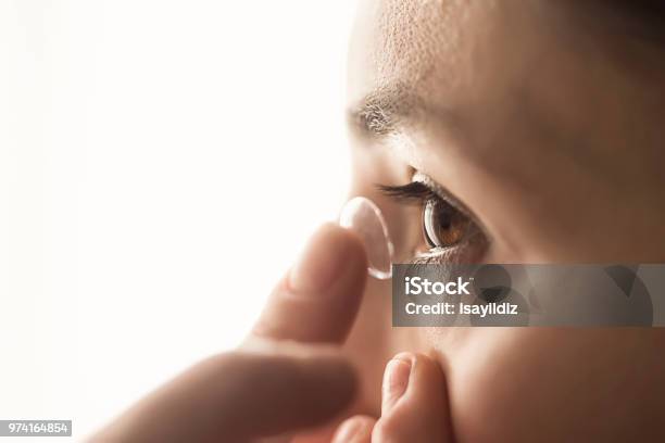 Woman Using A Contact Lens Stock Photo - Download Image Now - Contact Lens, Touching, Eye