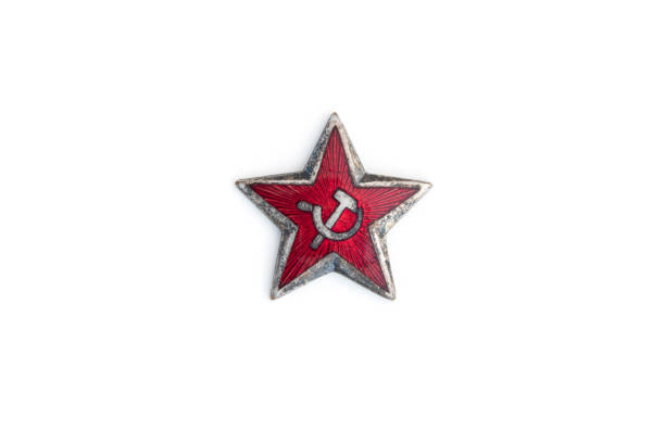 istock Old red star from military cap isolated on the white background 974165840