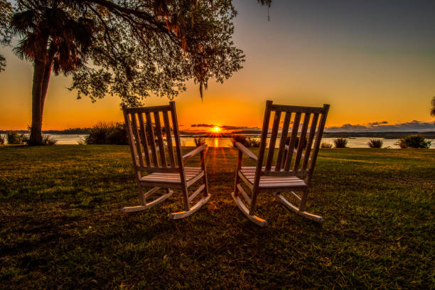 Morning Morning overlooking the marsh from Palmetto Bluff, outside of Bluffton, South Carolina rocking chair stock pictures, royalty-free photos & images