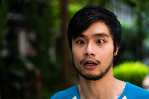 istock Portrait of a surprised young man 974166862