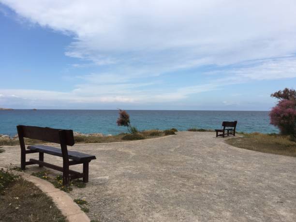 istock Benches by the sea 974174798