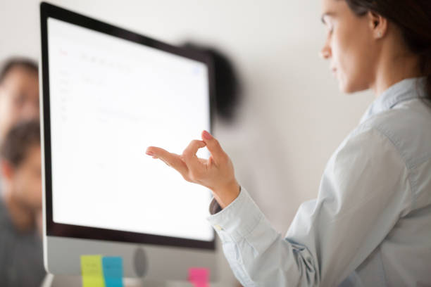 istock Close up of focused female employee relaxing at work 974191850