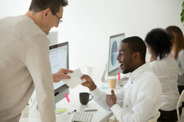 istock Excited black worker rewarded with money bonus for good work 974191994