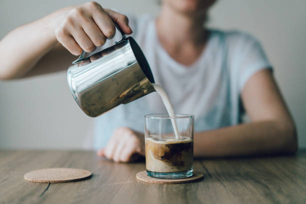 istock Iced Coffee with cream being poured in 974192384