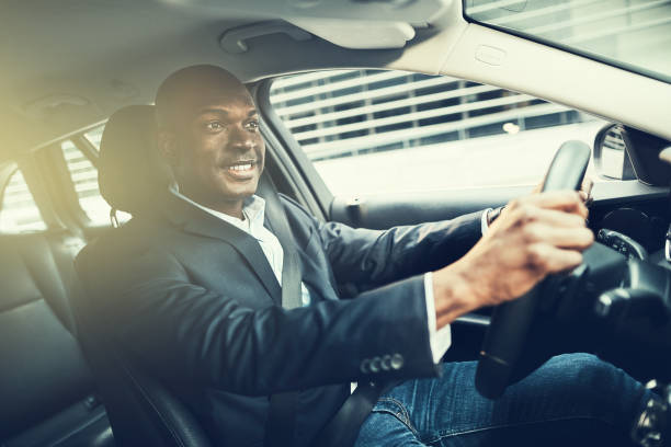 istock African businessman smiling during his drive to work 974193760