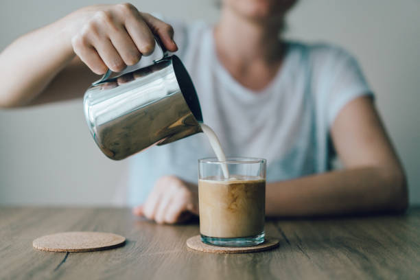 istock Iced Coffee with cream being poured in 974196520