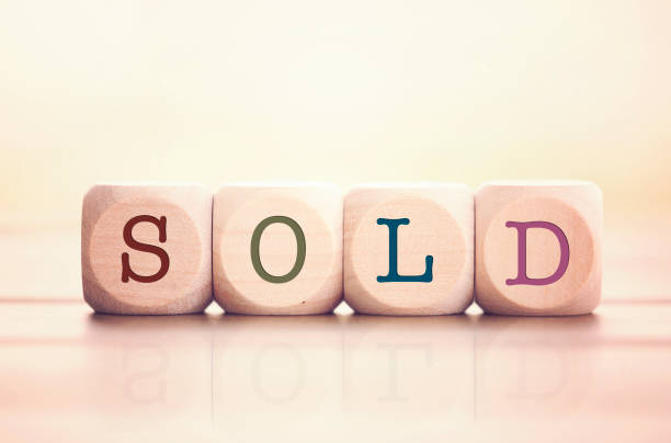 istock Sold word written on cube wooden blocks. 974197770