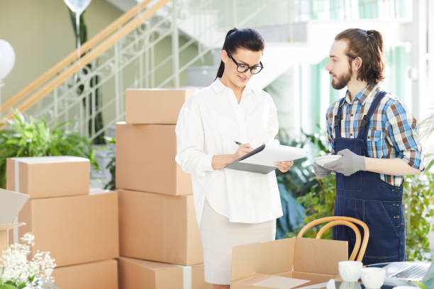 istock Confident female entrepreneur working with checklist 974198318