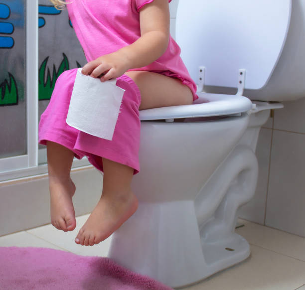 istock A child is sitting on the toilet 974203124