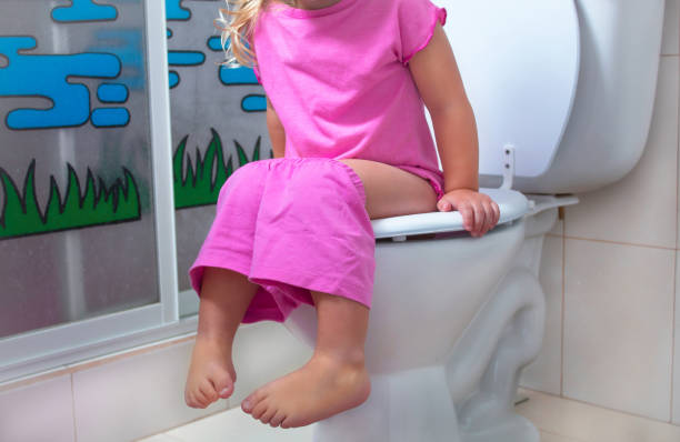 istock A child is sitting on the toilet 974205584