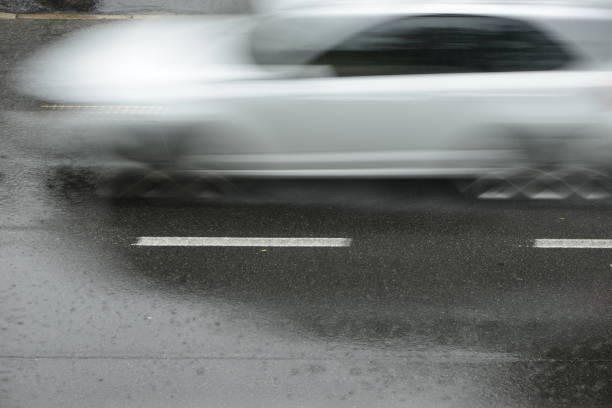 istock cars run on the road during a downpour 974205924