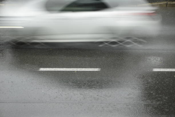 istock cars run on the road during a downpour 974208266