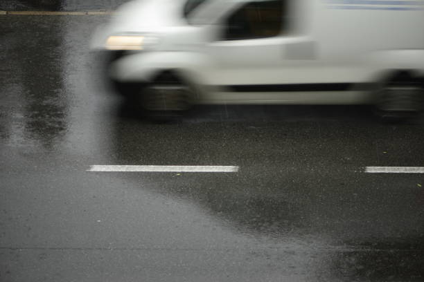 istock cars run on the road during a downpour 974208794