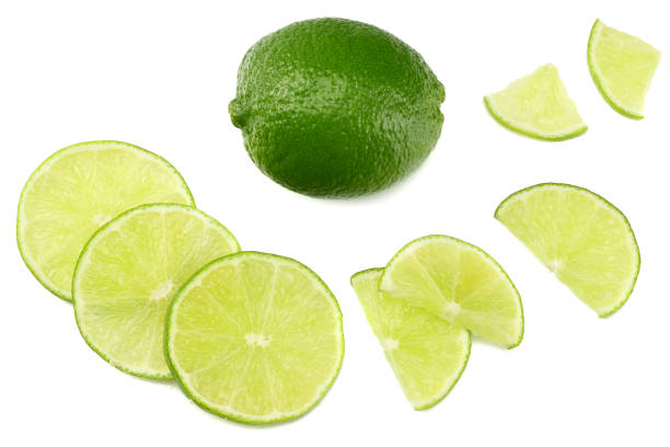 istock healthy food. sliced lime isolated on white background top view 974239484