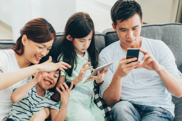 istock Young family have fun with digital devices 974241728