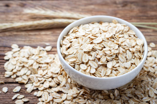 istock Dry rolled oat flakes oatmeal 974243800