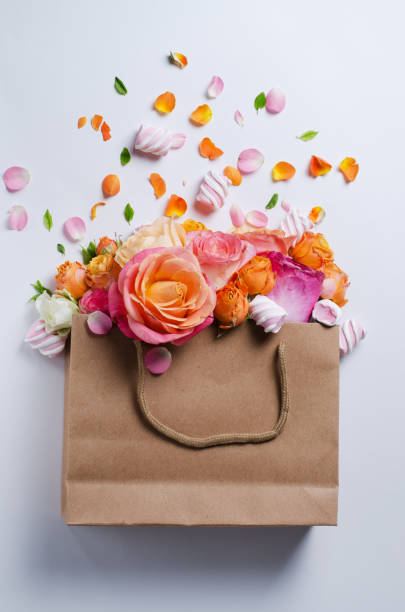 istock Live roses frame. Beautiful floral background. Card Template to spring holidays with creative space for text. 974258018
