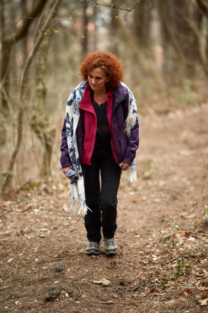 istock Woman hiking on a trail 974273658
