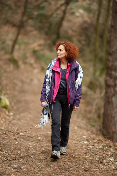 istock Woman hiking on a trail 974273662
