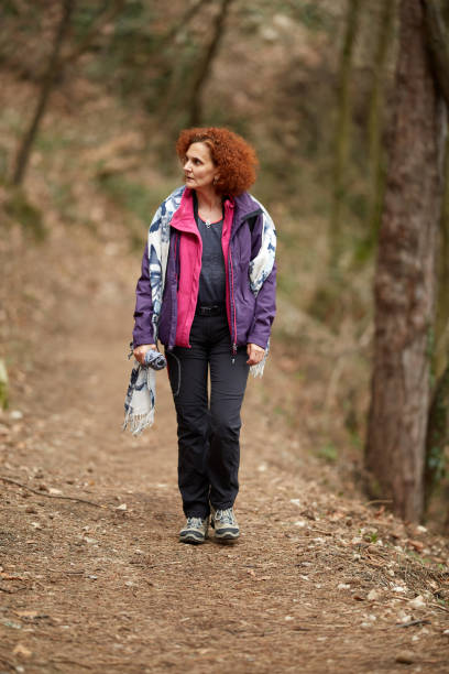 istock Woman hiking on a trail 974273692