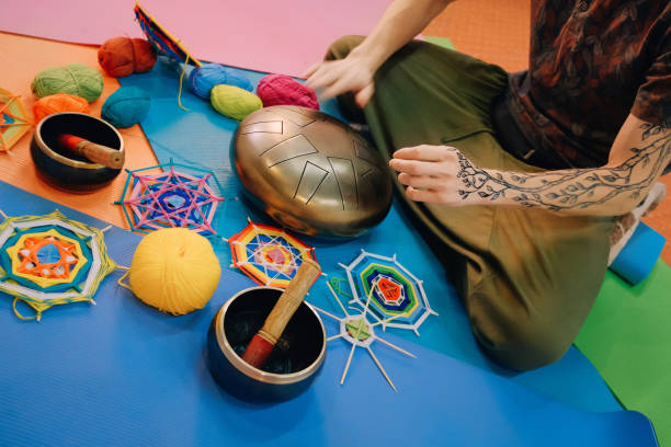 istock Male playing tank drum and practice yoga 974274096